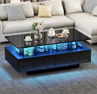 a black coffee table with blue lights on top